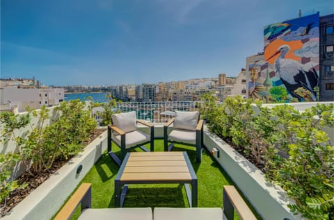 Property building, Communal lounge/ TV room, Day, Natural landscape, View (from property/room), Living room, Seating area, Evening entertainment, Sea view, sunbed