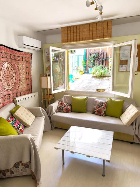 Living room, Seating area, Garden view, Garden view, air conditioner