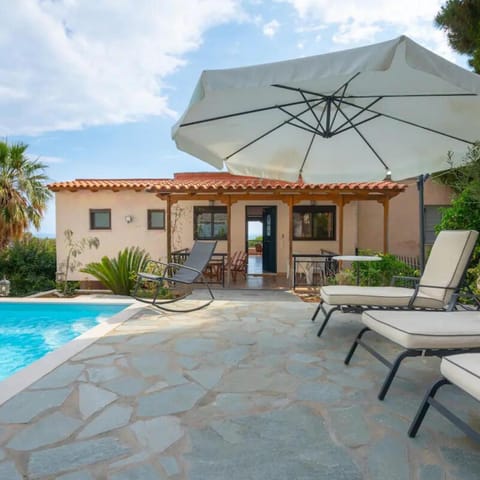Property building, Patio, Pool view, Swimming pool, sunbed
