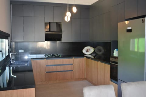 Kitchen or kitchenette, dishwasher, oven, stove