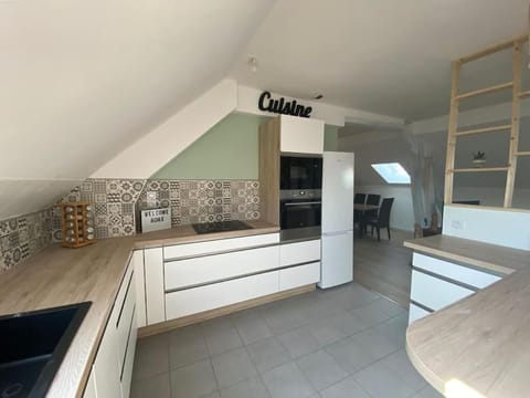 Kitchen or kitchenette, dishwasher, oven, stove