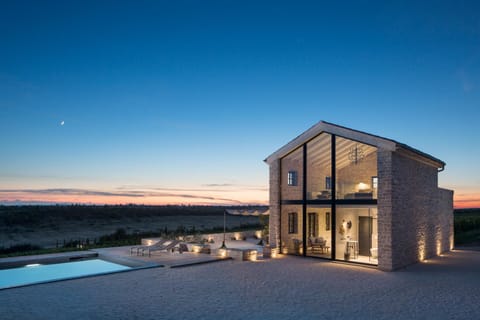 Property building, Patio, Night, Natural landscape, Pool view, Swimming pool, Sunset