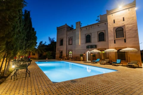 Property building, Patio, Night, Pool view, Swimming pool, sunbed