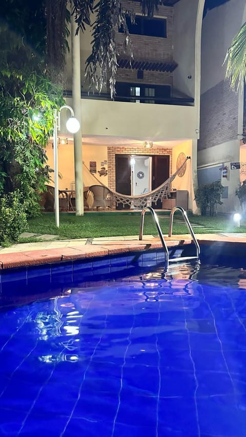 Property building, Night, Natural landscape, Pool view, Swimming pool, sunbed