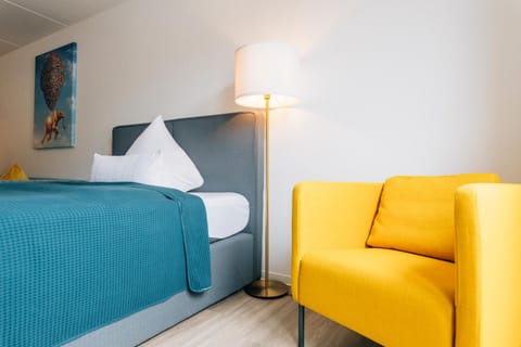 Bed, Seating area, Bedroom