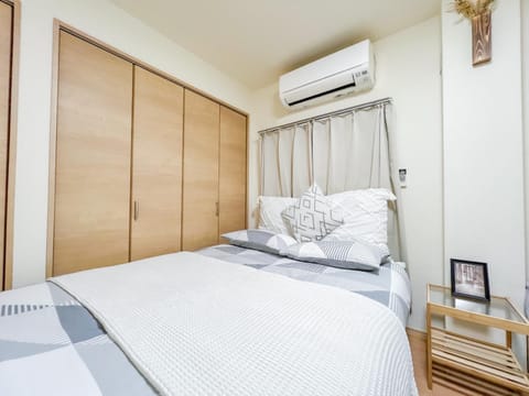 Bed, wardrobe, air conditioner