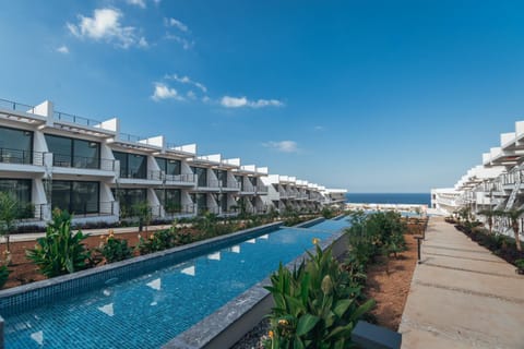 Property building, Day, Natural landscape, Pool view, Sea view, Swimming pool, sunbed