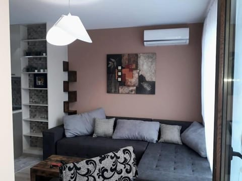 Bed, TV and multimedia, Living room, Seating area, air conditioner