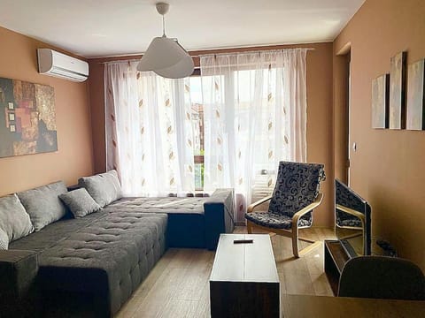 Bed, TV and multimedia, Living room, Seating area, air conditioner