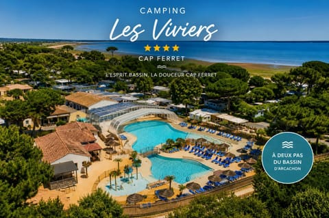 Nearby landmark, Day, Property logo or sign, Natural landscape, Beach, Logo/Certificate/Sign, Text overlay, Pool view, Sea view, Swimming pool, Certificate/Award, sunbed