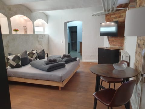 Living room, Photo of the whole room, Bedroom, furniture, stove, towels