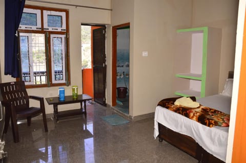 Toilet, Bed, Seating area, Bedroom