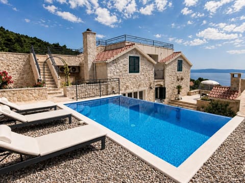 Property building, Patio, Day, Natural landscape, Pool view, Sea view, Swimming pool, sunbed