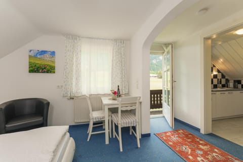 Bed, Living room, Seating area, Dining area