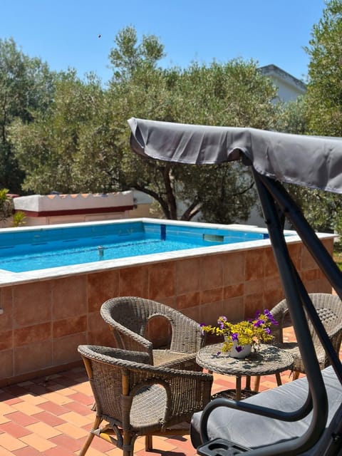 Patio, Day, Natural landscape, Pool view, Swimming pool, sunbed