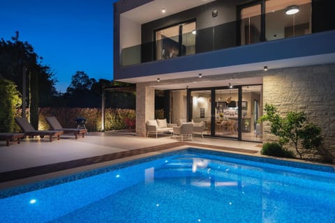 Property building, Patio, Night, Pool view, Swimming pool, Swimming pool, sunbed