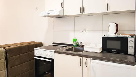 Kitchen or kitchenette, oven, stove