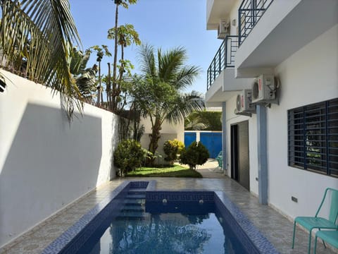 Property building, Patio, Day, Pool view, Swimming pool, sunbed