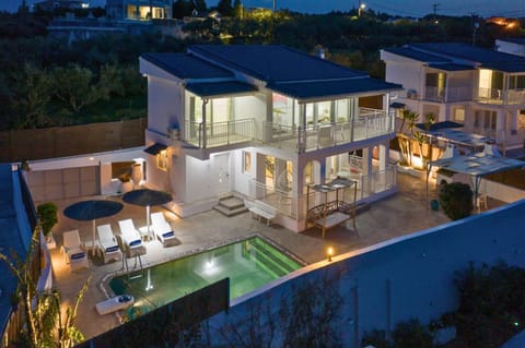 Property building, Patio, Night, Pool view, Swimming pool, sunbed