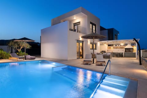 Property building, Patio, Night, Pool view, Swimming pool, sunbed