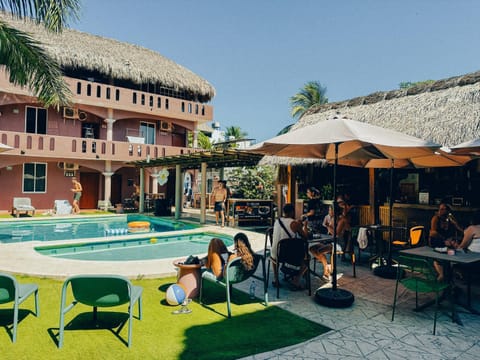 Property building, Patio, Day, People, Pool view, Swimming pool, group of guests, sunbed