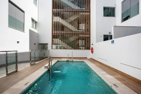 Property building, Living room, Swimming pool
