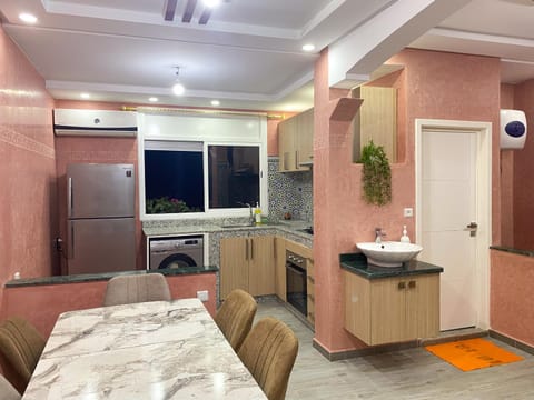Kitchen or kitchenette, Seating area, Dining area, oven, washing machine, kitchen, air conditioner