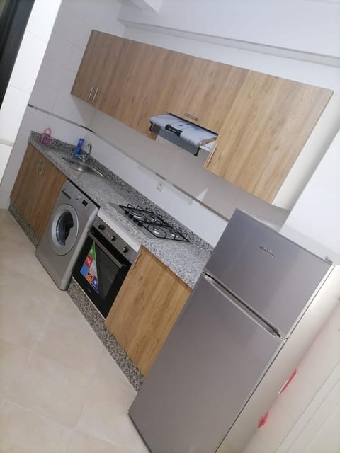 Kitchen or kitchenette, stove, washing machine