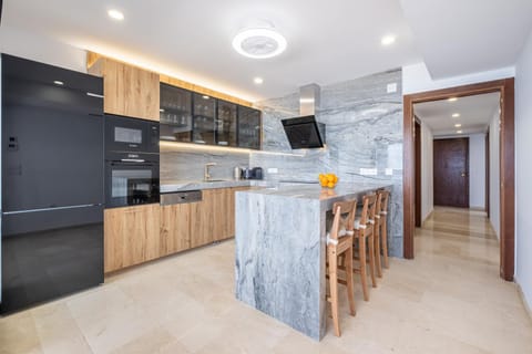 Kitchen or kitchenette, dishwasher, oven, stove