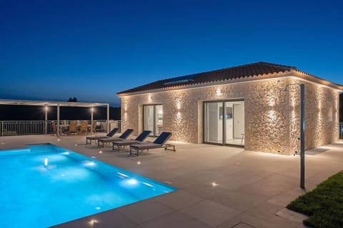Property building, Patio, Night, Pool view, Swimming pool