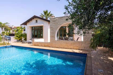 Property building, Patio, Pool view, Swimming pool, sunbed