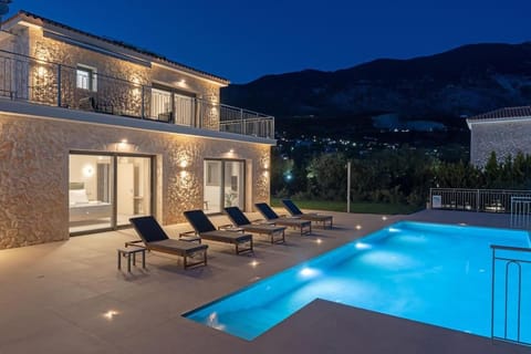 Property building, Patio, Night, Pool view, Swimming pool, sunbed