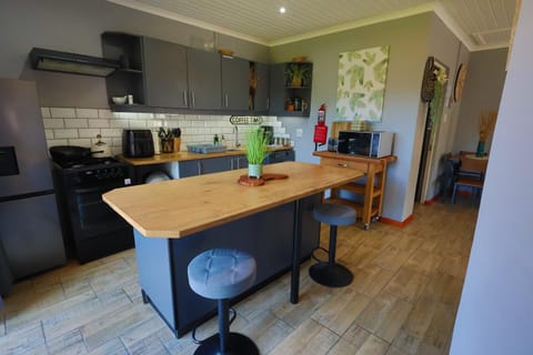 microwave, oven, stove, towels, kitchen