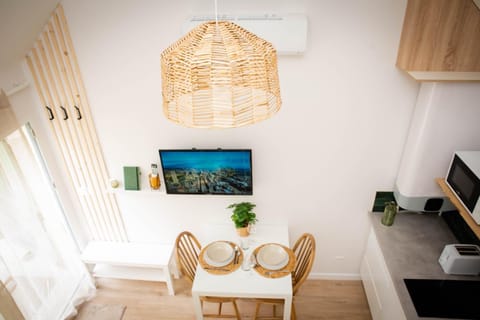 Bird's eye view, TV and multimedia, Kitchen or kitchenette, Living room, Seating area, Dining area, internet, air conditioner