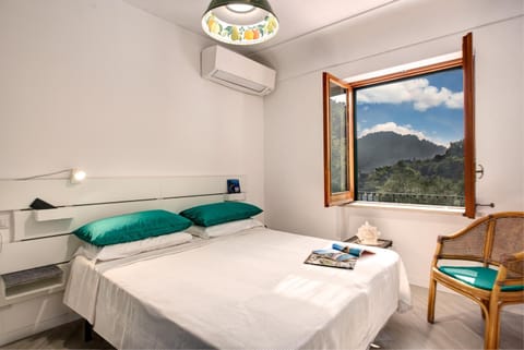 Bed, Natural landscape, Mountain view, towels, air conditioner