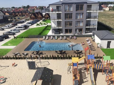 Property building, Children play ground, Swimming pool, Parking, sunbed