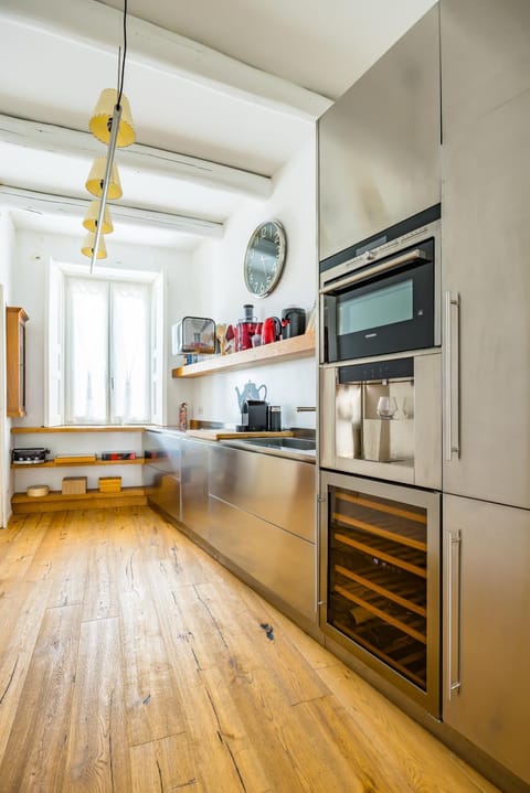 Kitchen or kitchenette, dishwasher, oven, stove