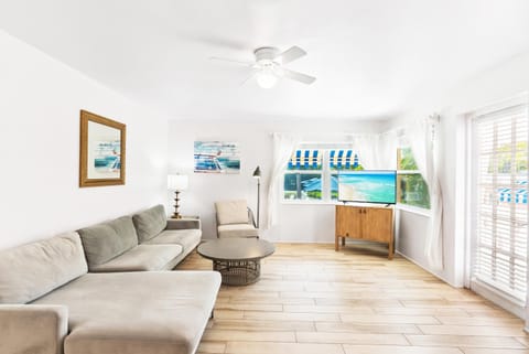 TV and multimedia, Living room, Seating area, Pool view, air conditioner