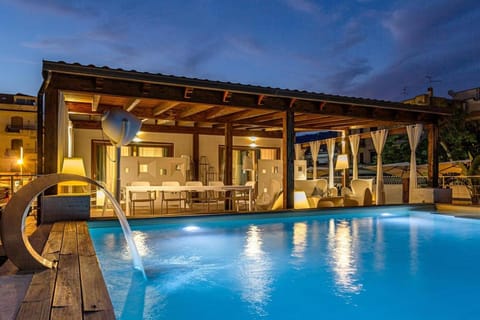 Property building, Patio, Night, Pool view, Swimming pool, Swimming pool