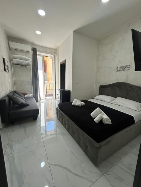 Photo of the whole room, Bedroom, towels, air conditioner