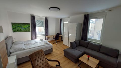 Bed, TV and multimedia, Living room, Seating area, Bedroom