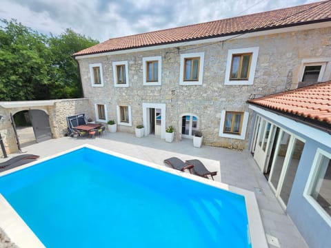 Property building, Patio, Swimming pool, sunbed