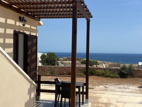 Property building, Patio, Natural landscape, Dining area, Sea view