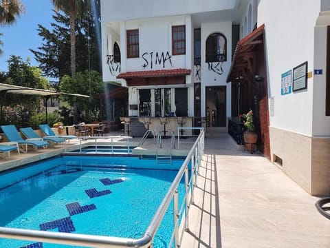 Property building, Day, Pool view, sunbed