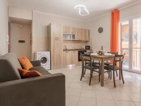 Kitchen or kitchenette, Living room, Dining area, stove, toaster, washing machine, dryer