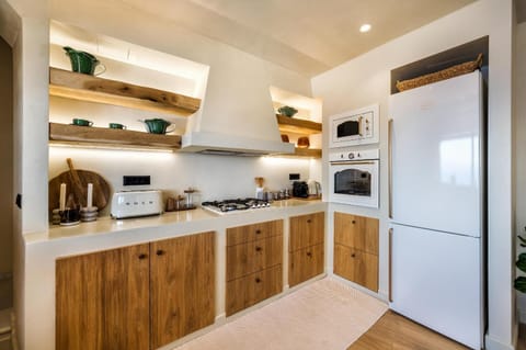 Kitchen or kitchenette, oven, stove, toaster