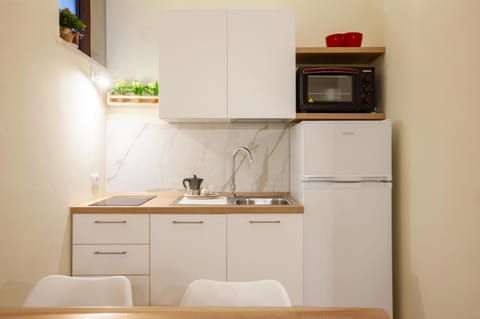 Kitchen or kitchenette, oven, stove