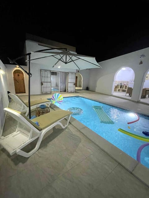 Patio, Night, Pool view, Swimming pool, sunbed