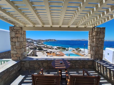 View (from property/room), Balcony/Terrace, Seating area, Pool view, Sea view