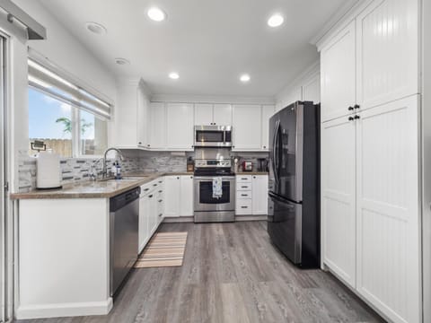 Kitchen or kitchenette, dishwasher, oven, stove, toaster